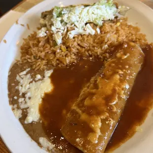 Enchilada, beans, refried beans (also comes with hard shelled taco-but it was being eaten at the time of this photo)