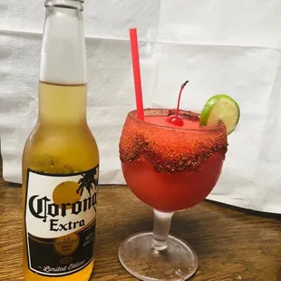 a drink and a bottle of corona extra