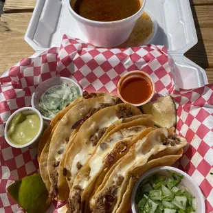 Five red tacos with consume