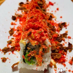 Cheeto Roll: Filled with delicious shrimp tempura , avocado, cucumber, crab, Hot Cheetos with Chef sauces.