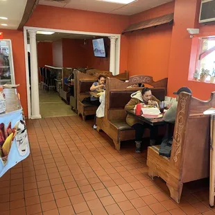 two children eating in a restaurant