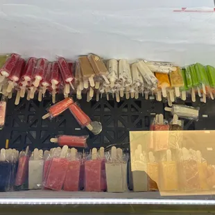 a variety of popsicles in a container