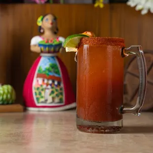 a bloody drink with a lime wedge