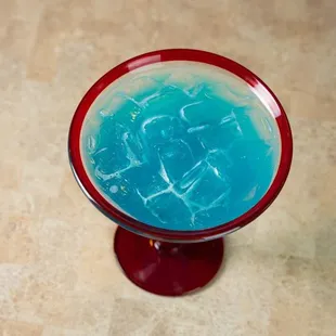 a blue liquid in a glass