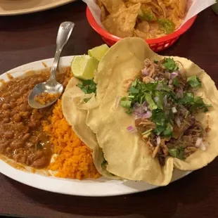 Carnitas Taco and carne Asada Taco with rice and beans