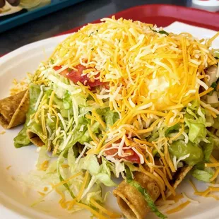 Chicken rolled tacos (5) with a soft drink for $8.99