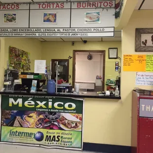 The counter and menus. There is English on the white paper posted.