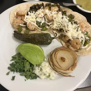 This was my 5 shrimp tacos. It's more filling than you would think. Of course we had our soup and chips and sauce before this came out.