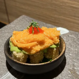 Salmon Bite: Crispy rice with pesto, spicy salmon, tobiko, and shiso