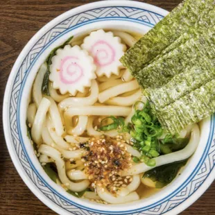 Udon noodle soup. Dashi soy stock base, naruto, nori.