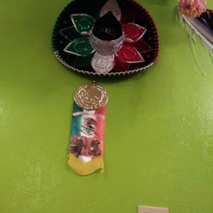 a mexican sombrena and a coin