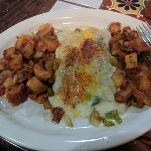 Veggie? Yes, you can! Spinach enchiladas with potato sides.