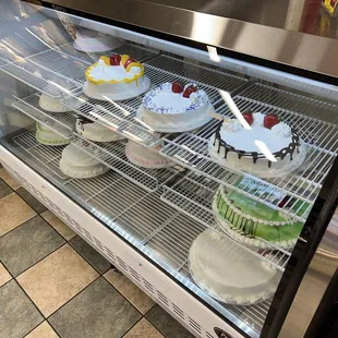 a display of cakes