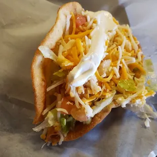 Crispy shredded chicken taco... by far the best thing we ordered.