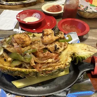 This meal is served in a pinnapple it has shrimp and chicken pineapple and vegetables 17.00