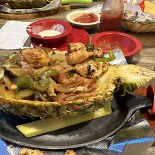 This is a huge meal serve red in pinnapple chicken shrimp vegetable and pinnapple only 17.00