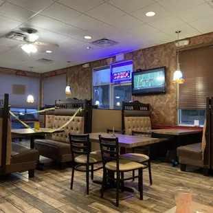 Interior with caution tape obstructing every other booth