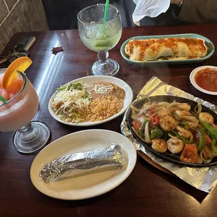 Shrimp fajitas, burrito Durango, frozen strawberry margarita and lime margarita on the rocks