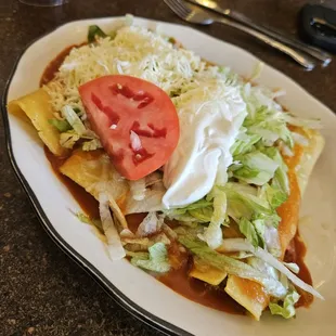 Cheese, chicken, bean and beef enchiladas