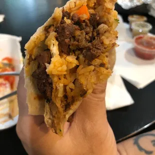 When did Steak burrito start have green bean carrot peas corn in it ?