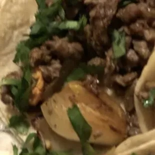 Kearny Carne asada tacos with a big ass onion pit in the middle