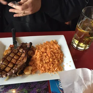Ribeye and shrimp with a beer