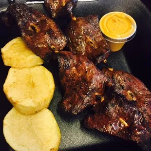 Anticuchos---USDA certified beef heart skewers marinated in Peruvian spices, served with fried potato medallions and our Roco...