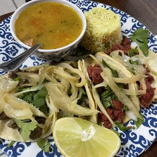 Plate off for tacos, two Al pastor and two fajitas tacos