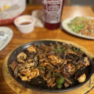Shrimp, steak and chicken fajitas
