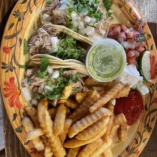 Chicken tacos and French fries instead of rice and beans.