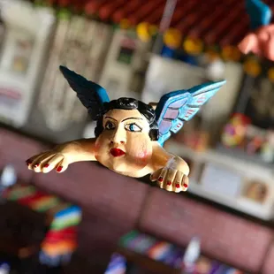 a figurine of a woman flying in the air