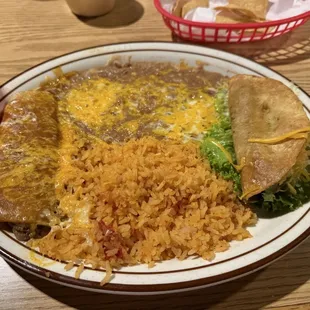 Shredded beef enchilada, shredded beef taco, with rice and beans
