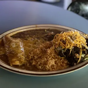 A fajita taco and chicken enchilada dinner