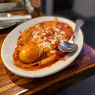 a plate of food with a spoon
