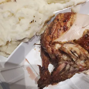 chicken and mashed potatoes in a styrofoam container