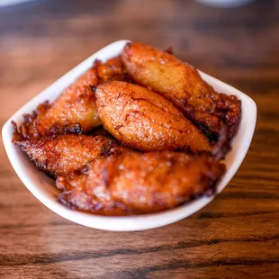 a bowl of fried donuts