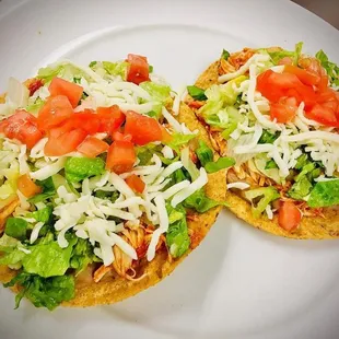 two tacos on a white plate