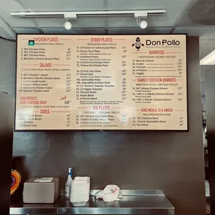 Inside: Menu TV screen behind the order counter as of July 2022