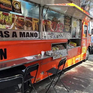 a food truck parked on the side of the road