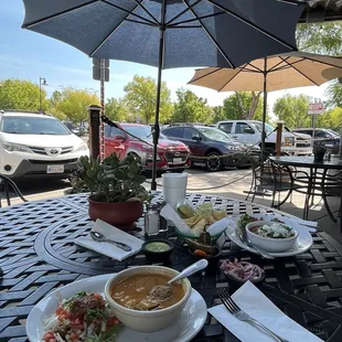 a table with food and an umbrella