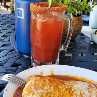 Wet Grande Burrito de adobada con Michelada. I left my half gallon water bottle next to it for perspective.