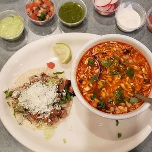 Close up of soup and taco