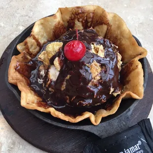 Fried ice cream in a sizzling cast iron skillet. We asked for no whipped cream.
