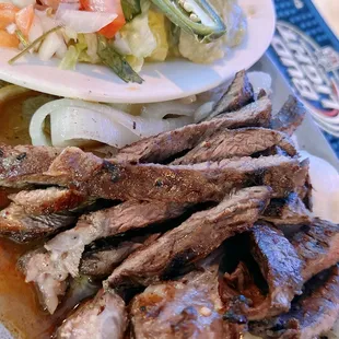 a plate of meat and vegetables