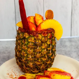 a pineapple filled with fruit