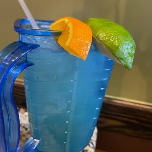 a blue drink in a pitcher