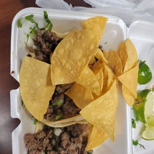 3 beef tacos and chips.