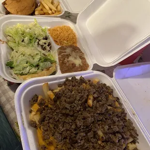 Milanesa torta, zopes with arroz and frijoles, and carne asad fries