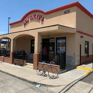 a bicycle parked in front of a restaurant