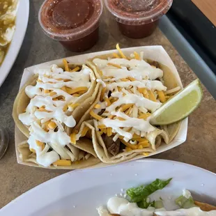 Asada tacos with cheese/sour cream